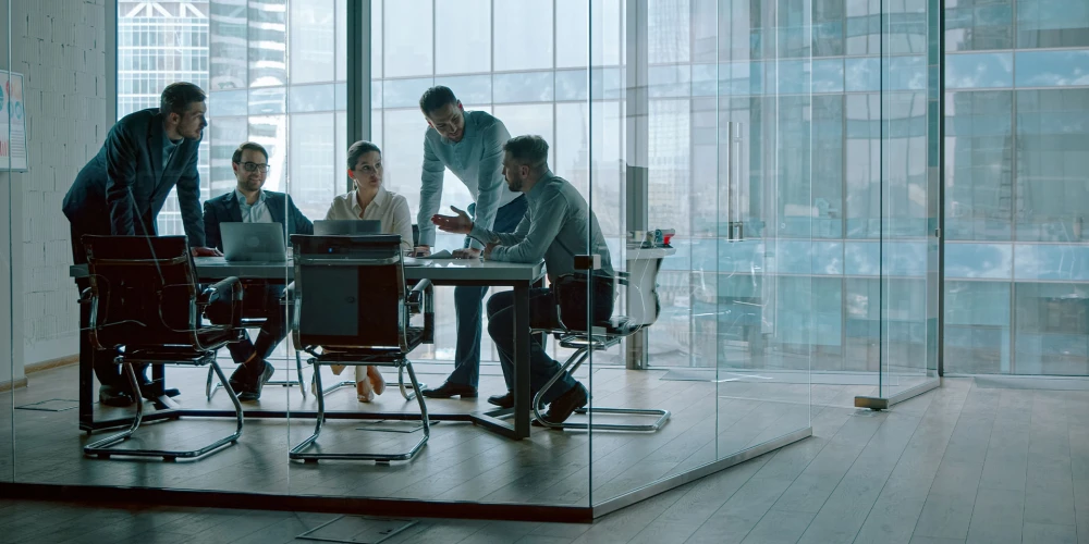 Business team in a meeting in a modern office with glass walls